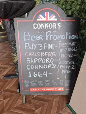 a sign for a beer promotion in a store at Dorsett Residence by 