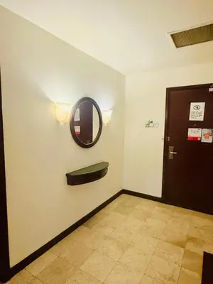 a room with a mirror and a door with a mirror at Times square by Willow Trip in Kuala Lumpur