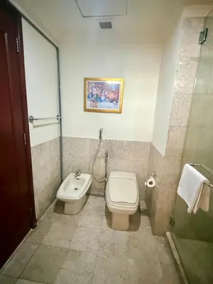 a bathroom with a toilet and a sink at Times square by Willow Trip in Kuala Lumpur