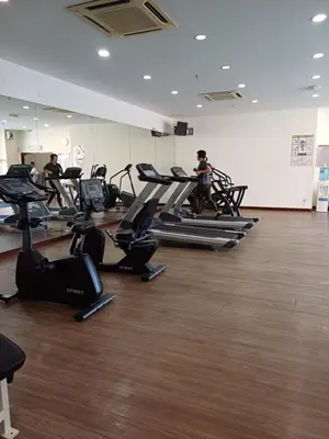a group of people exercising on treadmills in a gym at KL Advice Suite At Times Square in Kuala Lumpur