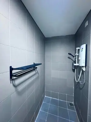 a bathroom with a shower with a phone on the wall at Mercu Summer suites KLCC by JK Privy Homes - 7 Pax Family Stay in Kuala Lumpur