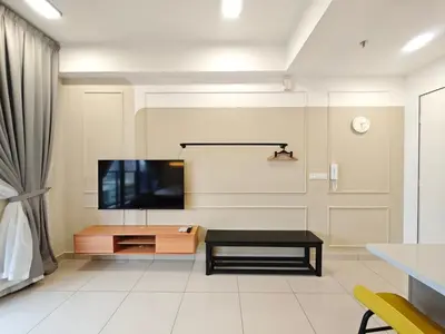 a living room with a flat screen tv on a wall at TRION The 107 Family Suites POOL VIEW in Kuala Lumpur