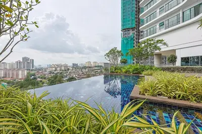 a swimming pool in the middle of a building at Elegant Skyline Suite Datum Jelatek near KLCC in Kampong Datok Keramat