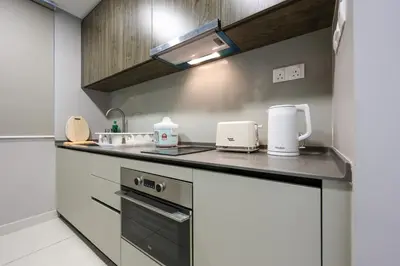 a kitchen with a counter with appliances on it at Elegant Skyline Suite Datum Jelatek near KLCC in Kampong Datok Keramat