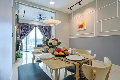 a kitchen and dining room with a table and chairs at Elegant Skyline Suite Datum Jelatek near KLCC in Kampong Datok Keramat