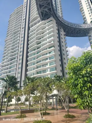 a tall building with trees in front of it at Elegant Skyline Suite Datum Jelatek near KLCC in Kampong Datok Keramat