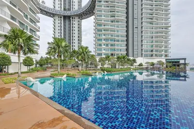 a large swimming pool in front of tall buildings at Elegant Skyline Suite Datum Jelatek near KLCC in Kampong Datok Keramat