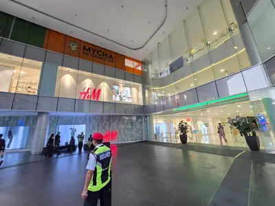 a man standing in front of a shopping mall at Quill Resort Suites Star House in Kuala Lumpur