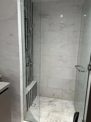 a shower with a glass door in a bathroom at Eaton Residence KLCC by Majestic Hospitality in Kuala Lumpur