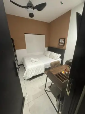 a bedroom with a bed and a table in it at KL City, Neu Suites 2Bedroom 2Bathroom in Kuala Lumpur