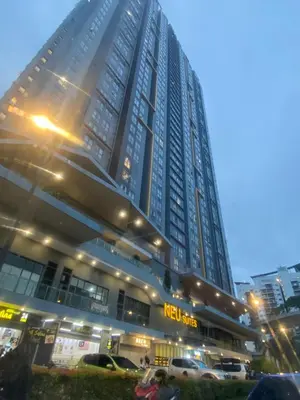 a tall building with cars parked in front of it at KL City, Neu Suites 2Bedroom 2Bathroom in Kuala Lumpur