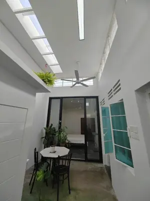 a dining room with a table and chairs in a room at Zen 1 Room KL in Kuala Lumpur