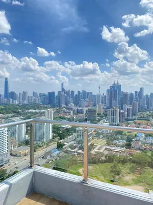 a view of a city from the balcony of a building at Neu Suite by Triple A in Kuala Lumpur