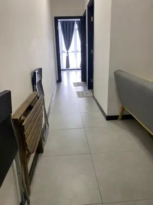 a room with a hallway with a bed and a window at Neu Suite by Triple A in Kuala Lumpur