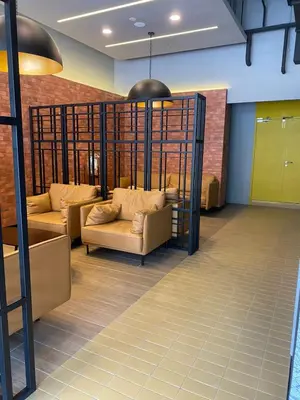 a living room with two couches in a room at Neu Suite by Triple A in Kuala Lumpur