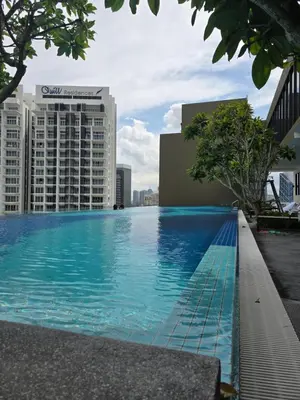 a swimming pool on the roof of a building at City centre Majestice Suite KLCC in Kuala Lumpur