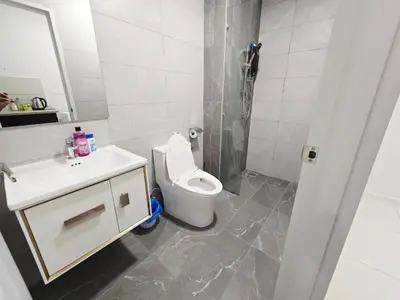 a bathroom with a toilet and a sink and a shower at City centre Majestice Suite KLCC in Kuala Lumpur