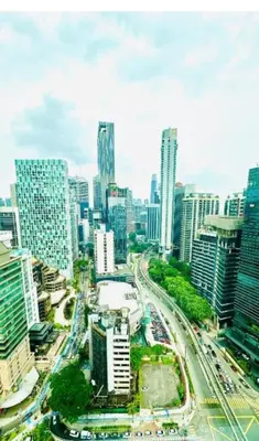 a city with tall buildings and a highway at park view one bedroom apartment klcc in Kuala Lumpur