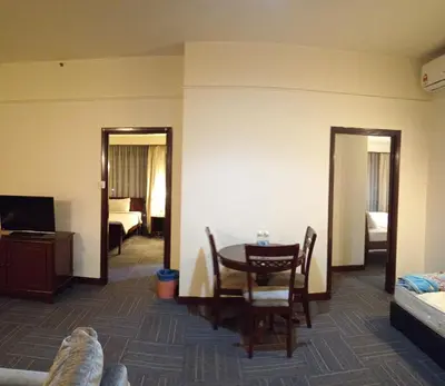 a room with a table and a room with a bedroom at MY HOMEs TIMES SQUARE in Kuala Lumpur