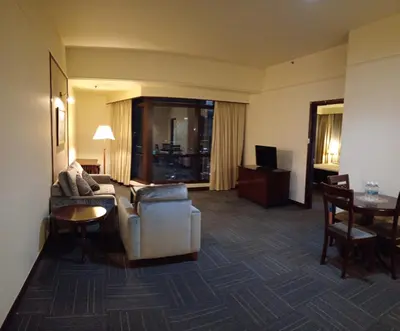 a living room with a couch and a table at MY HOMEs TIMES SQUARE in Kuala Lumpur