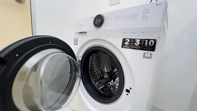 a washing machine sitting next to a dryer at Majestic Residence sky pool 10mins to KLCC By Light House in Kuala Lumpur