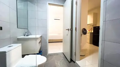 a white bathroom with a toilet and a sink at Majestic Residence sky pool 10mins to KLCC By Light House in Kuala Lumpur