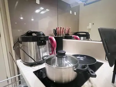 a kitchen counter with a pot on a stove at Dorsett Hartamas Mont Kiara Kuala Lumpur Mitec by innfinitystay in Kuala Lumpur