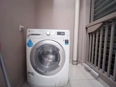 a washing machine in a corner of a room at Dorsett Hartamas Mont Kiara Kuala Lumpur Mitec by innfinitystay in Kuala Lumpur