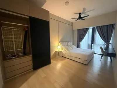 a bedroom with a bed and a ceiling fan at KL Star Residance KLCC by Nexus in Kuala Lumpur