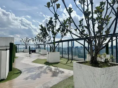 a building with a tree on top of it at Reizz Residence by Willow Trip in Kuala Lumpur