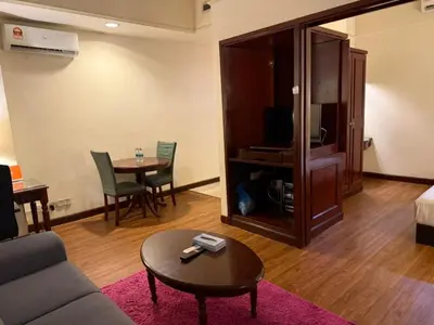 a living room with a couch and a table at KL Suite at Times Square in Kuala Lumpur