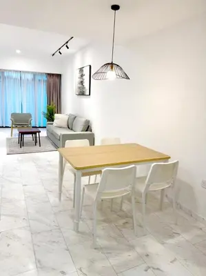 a dining room with a table and a couch at Eaton Hotel \u4f0a\u987f\u9152\u5e97 \u4e94\u661f\u7ea7\u9152\u5e97 in Kuala Lumpur