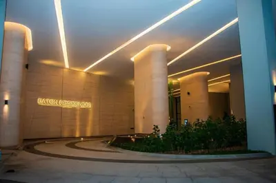 a lobby of a building with a sign on it at Eaton Hotel \u4f0a\u987f\u9152\u5e97 \u4e94\u661f\u7ea7\u9152\u5e97 in Kuala Lumpur