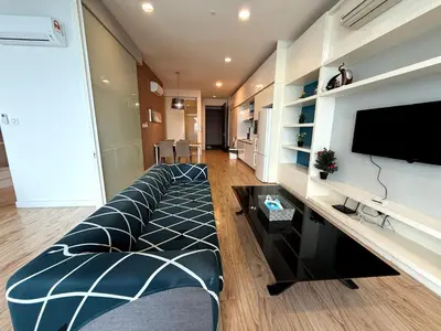 a living room with a couch and a flat screen tv at The Platinum suites by HIMU in Kuala Lumpur