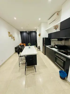 a kitchen with a table and chairs in a room at Lucentia Residence Skyline KL Stay in Kuala Lumpur
