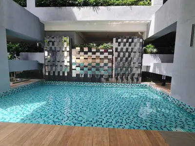 a swimming pool in the middle of a building at Small Studio Neu Suites Gleneagles Ampang KL in Kuala Lumpur