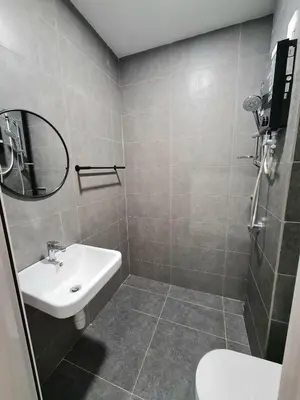 a bathroom with a white sink and a mirror at Small Studio Neu Suites Gleneagles Ampang KL in Kuala Lumpur