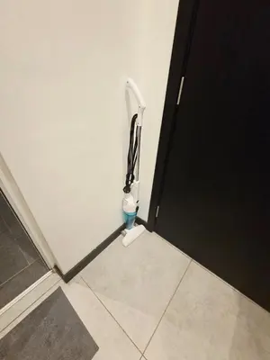 a bathroom with a toilet in the corner of a room at Little Studio Neu Suites near KLCC in Kuala Lumpur