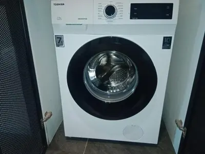 a white washing machine in a room at Scarletz Suites Klcc Twin tower by Lucky in Kuala Lumpur