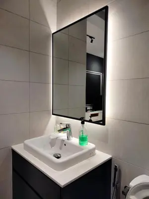a bathroom with a sink and a large mirror at skyscraper by cozy in Kuala Lumpur