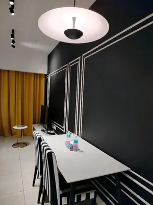 a conference room with a long table and chairs at skyscraper by cozy in Kuala Lumpur
