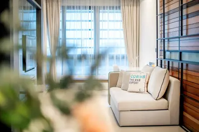 a white chair in a room with a window at Novo Ampang Residence Studio Close to KLCC and Gleneagles in Kuala Lumpur