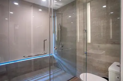 a bathroom with a glass shower with a toilet at Novo Ampang Residence Studio Close to KLCC and Gleneagles in Kuala Lumpur