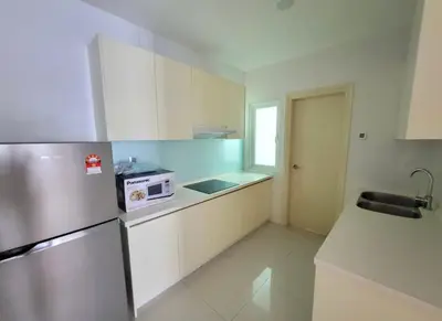 a kitchen with a refrigerator and a microwave at Scarletz Suites KLCC by ENBA in Kuala Lumpur