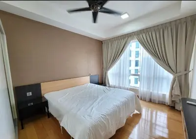 a bedroom with a bed and a ceiling fan at Scarletz Suites KLCC by ENBA in Kuala Lumpur