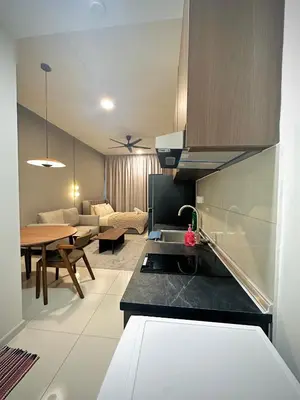 a kitchen and a living room with a table at Majestic Residence KLCC By Homestay in Kuala Lumpur