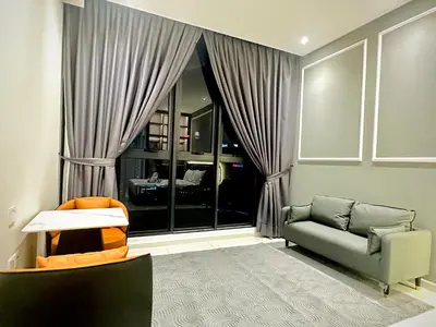 a living room with a couch and a window at Majestic Residence KLCC By Homestay in Kuala Lumpur