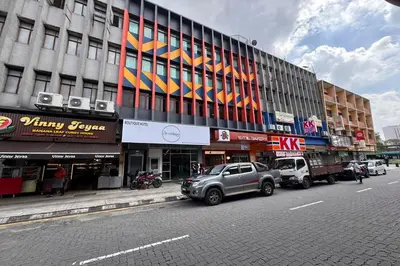 a truck parked in front of a building on a street at Lofts At Hang Kasturi Kuala Lumpur in Kuala Lumpur