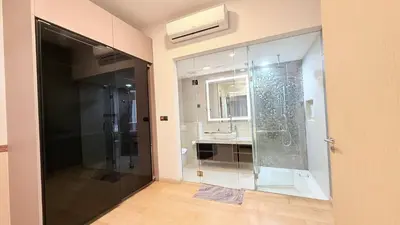 a bathroom with a glass shower and a sink at Star Residences Apartment KLCC in Kuala Lumpur