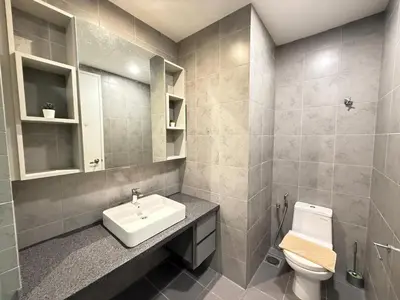 a bathroom with a sink and a toilet at Vortex suites klcc 8pax with City views in Kuala Lumpur